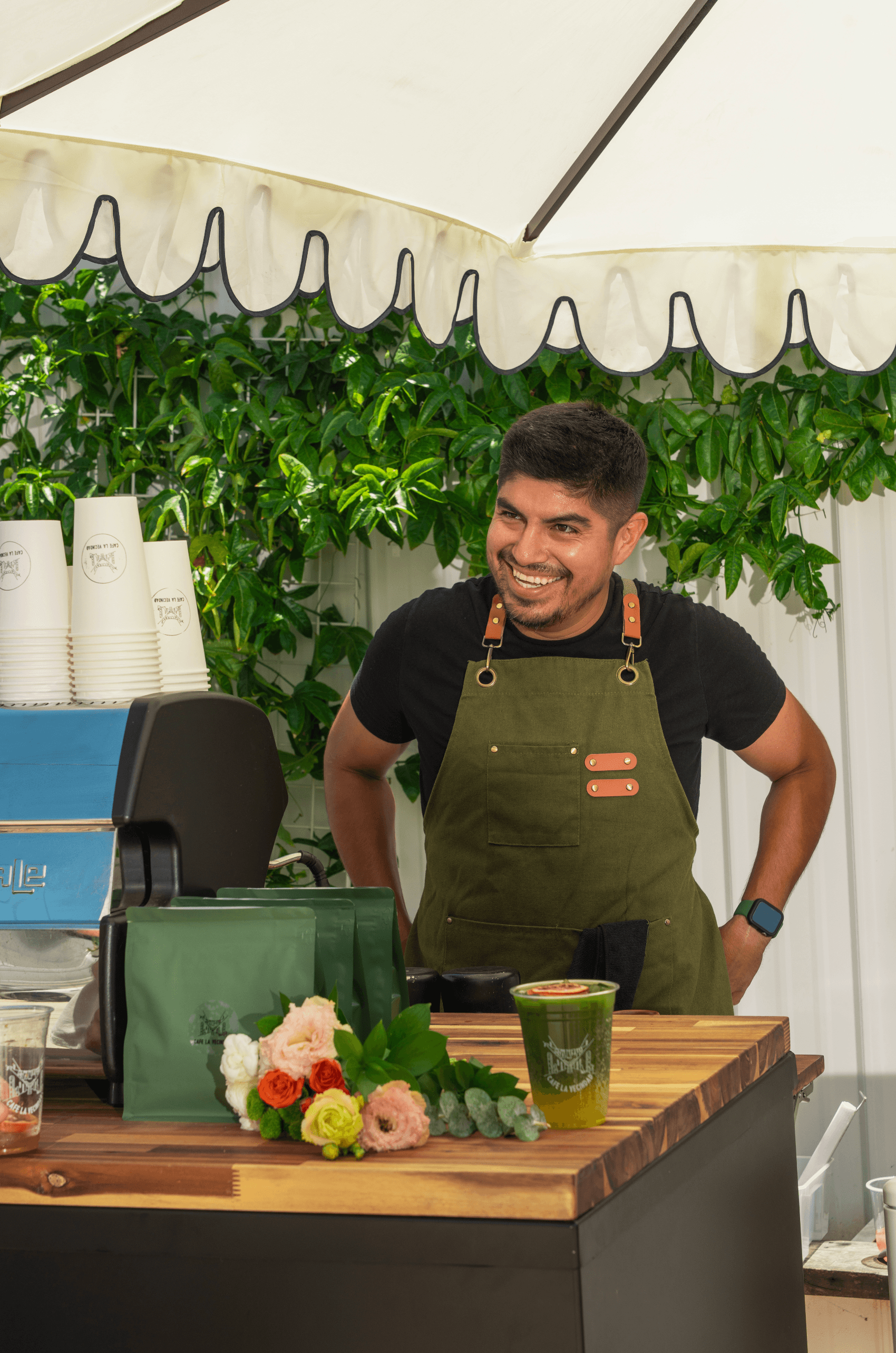 Vendor pouring drinks at the beverage lab